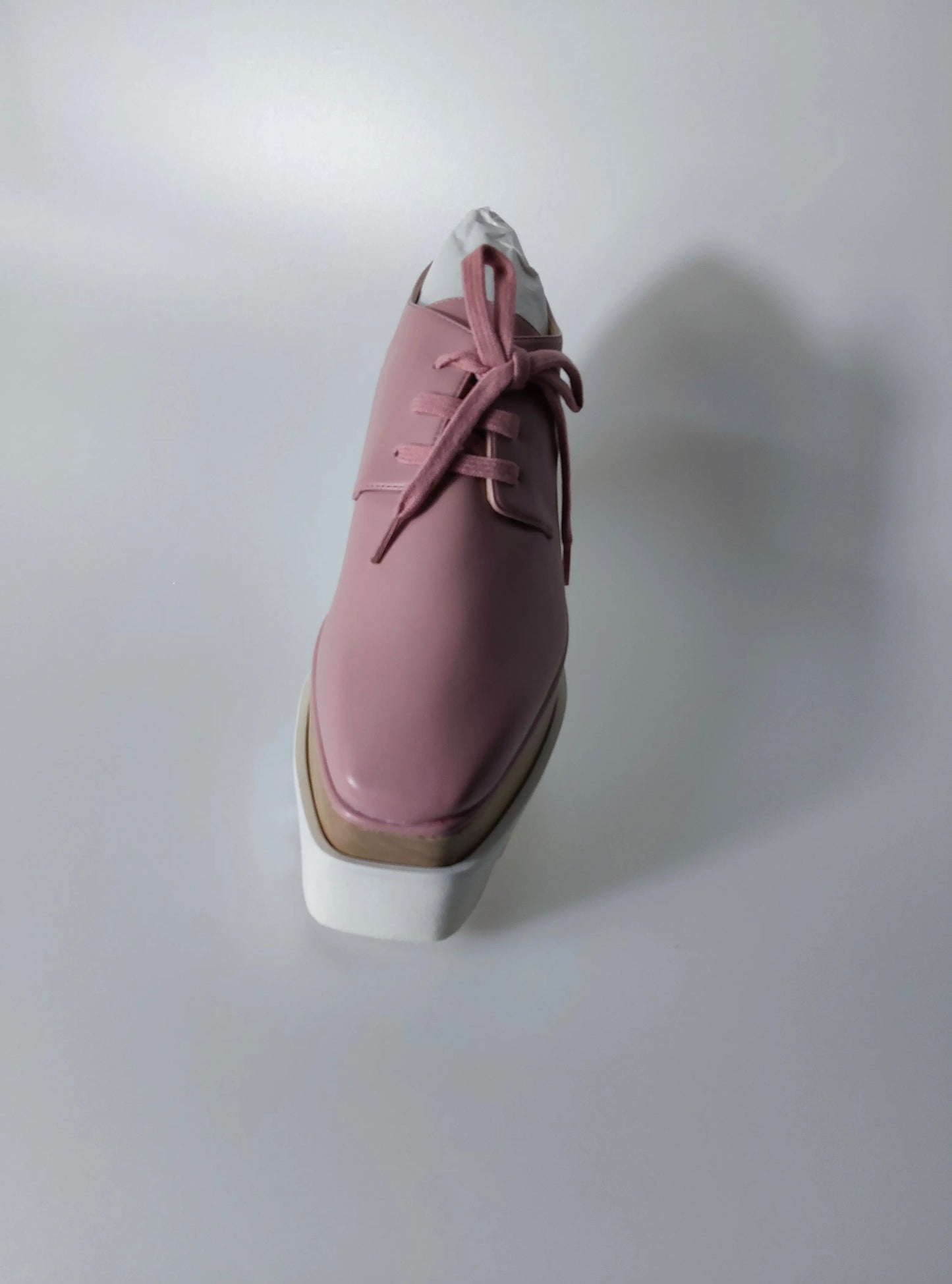Sneaker plateforme Elyse rose pour femme de Stella McCartney avec lacets et semelle épaisse blanche.