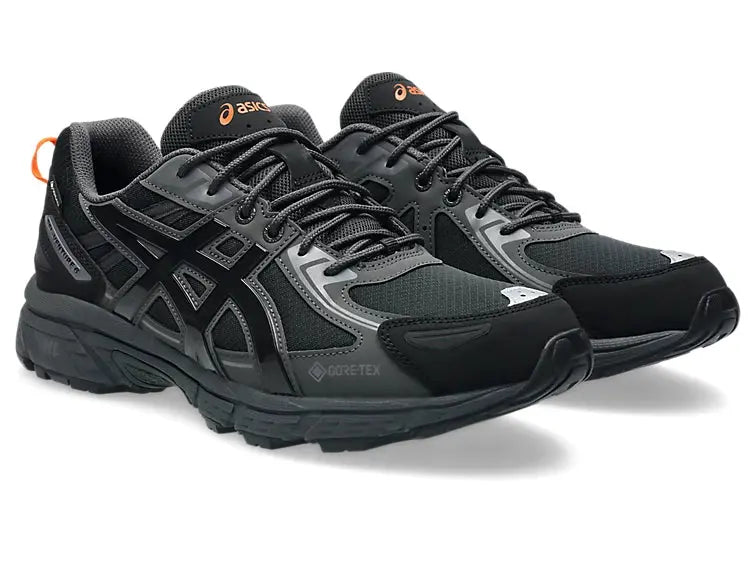 Chaussures de trail noires Asics Gel-Venture 6 GTX de Asics, avec détails orange sur le logo et le tirant arrière.