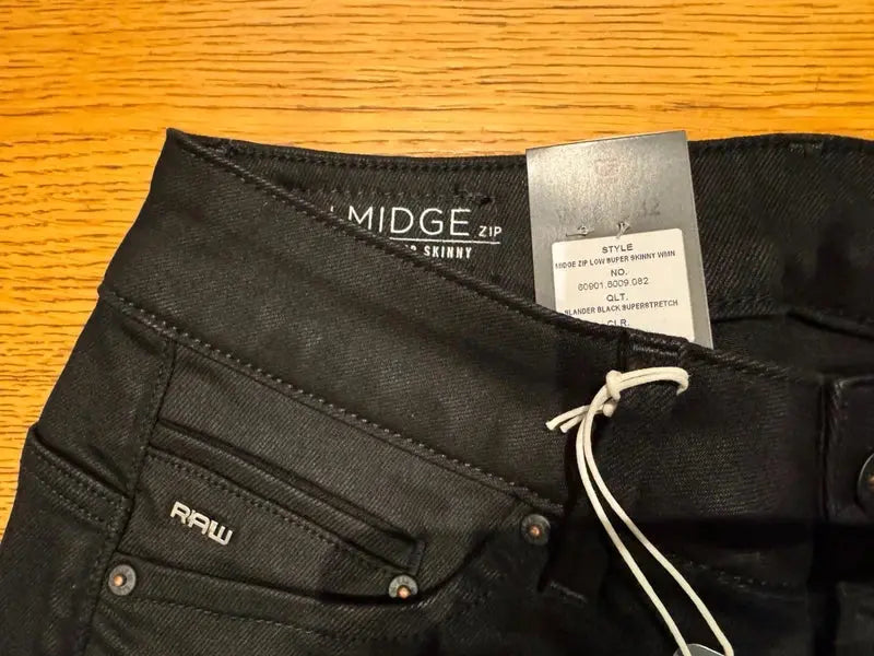 Jean noir super skinny de G-Star RAW avec détail de fermeture éclair et étiquette.