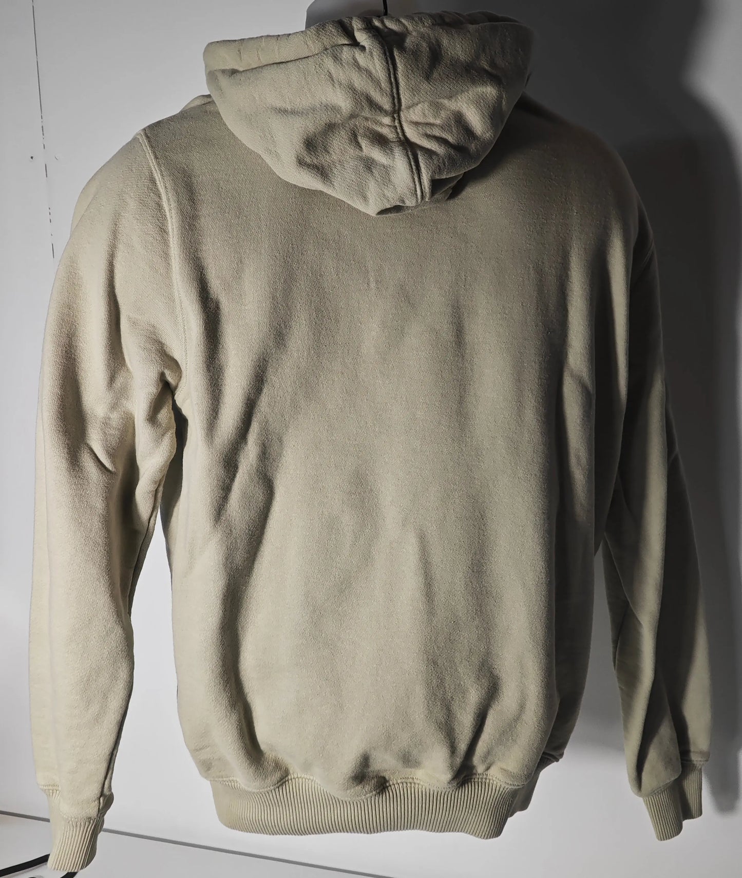 Sweat à capuche beige de Off-White, vue arrière, avec cordon de serrage réglable.