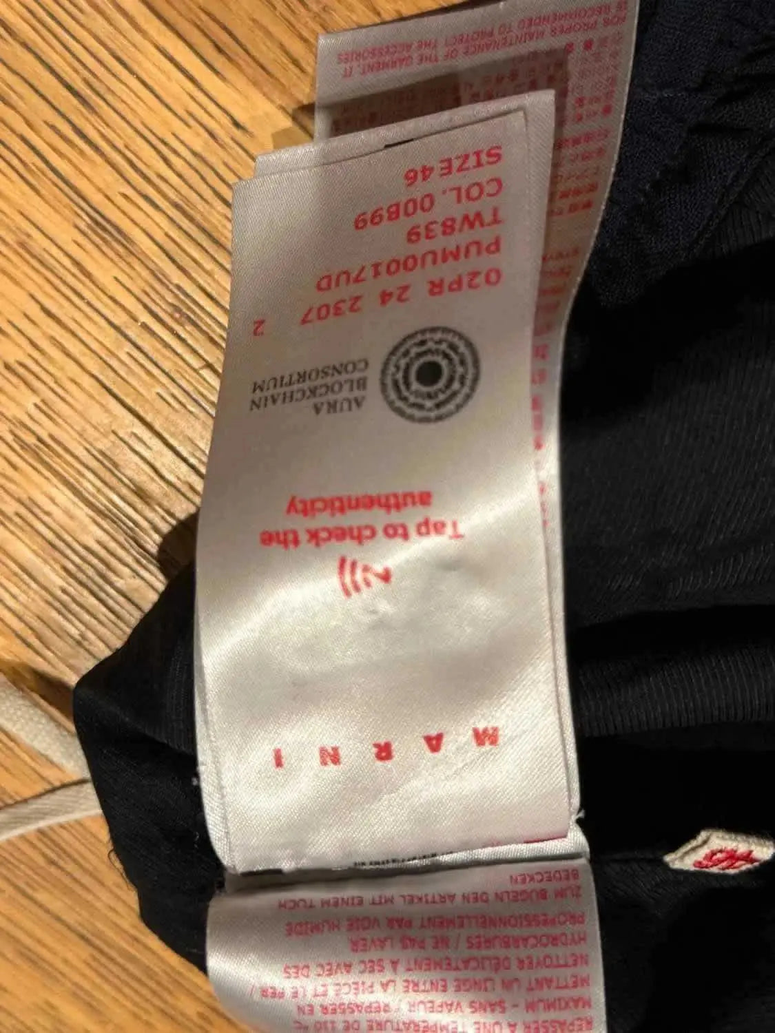 Pantalon ample noir taille 46 de Marni, avec étiquette d'entretien et logo d'authenticité.