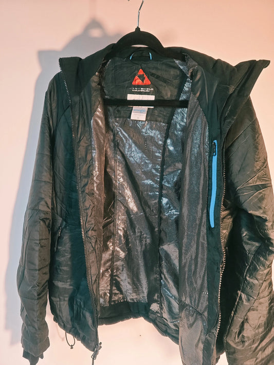 Veste noire Columbia Interchange Omni-Heat de Columbia, doublure réfléchissante argentée et détails bleus.