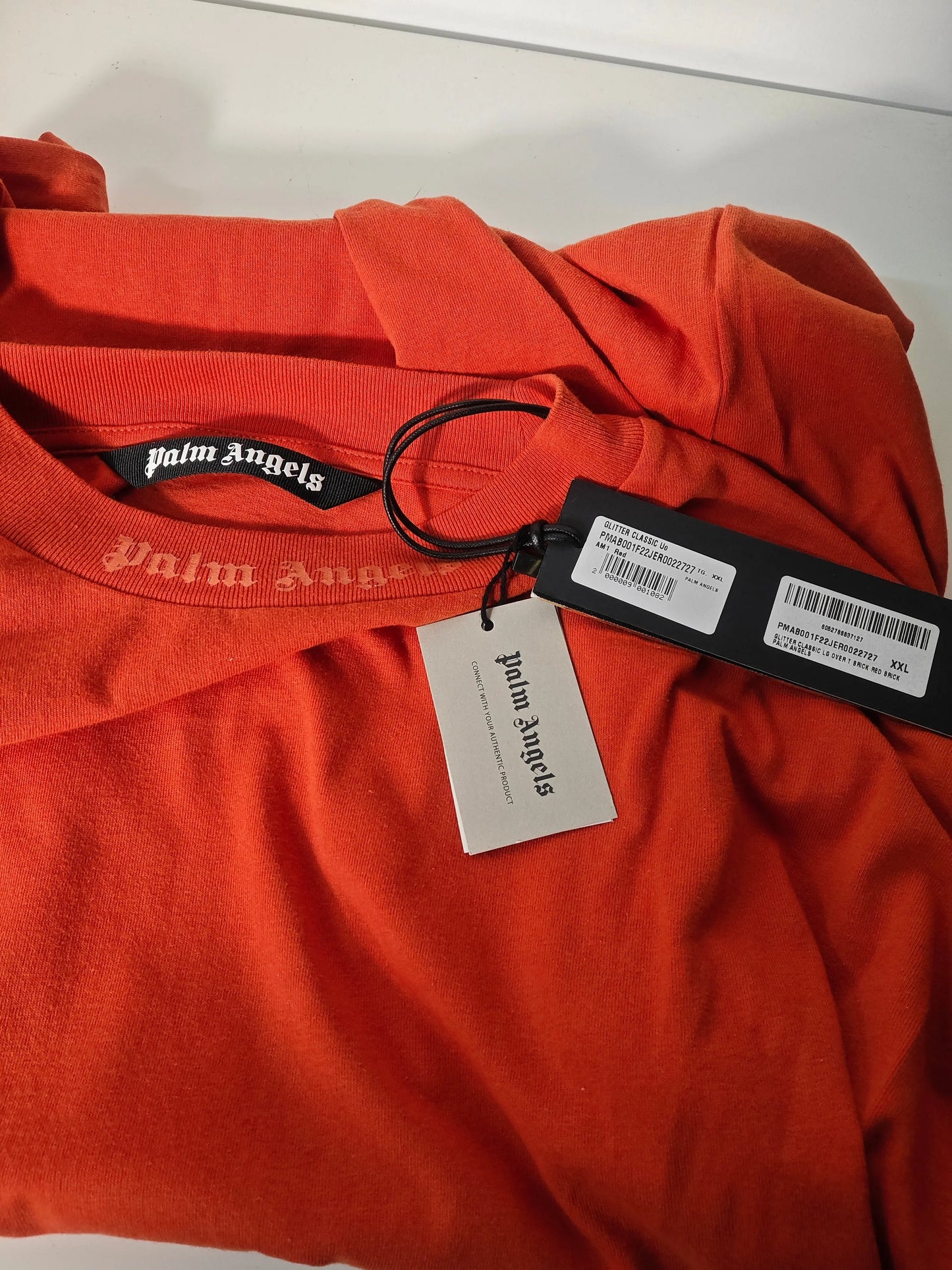 T-shirt orange oversize de Palm Angels avec logo sur le col ras du cou.
