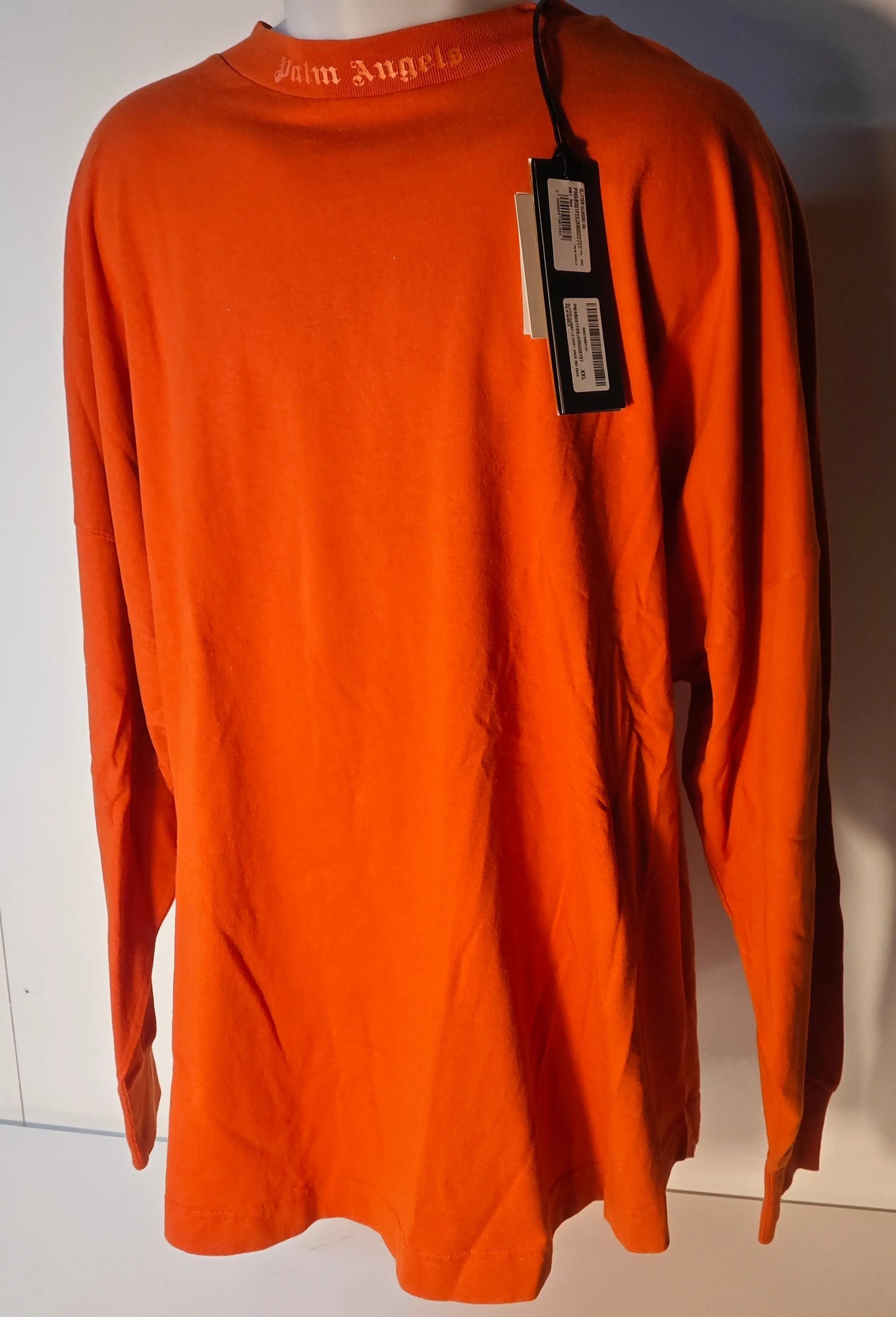 T-shirt orange à manches longues oversize de Palm Angels, avec logo sur le col.