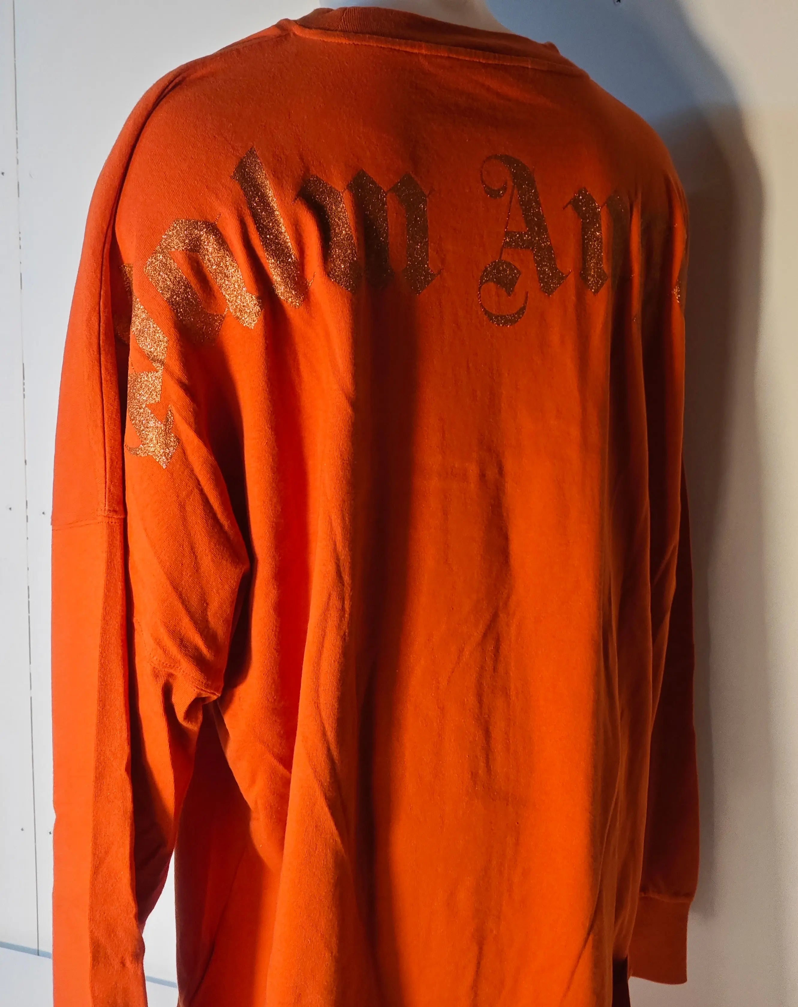 T-shirt orange oversize taille XXL de Palm Angels, avec inscription pailletée au dos.