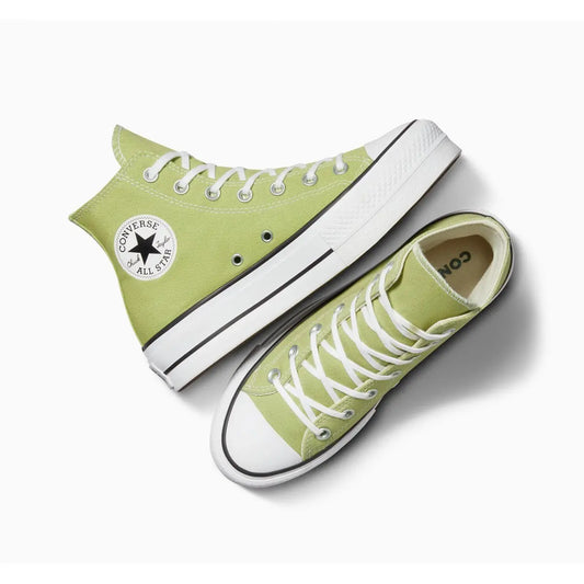 Baskets montantes vertes « Chuck Taylor All Star Lift » de Converse, avec semelle compensée blanche.

