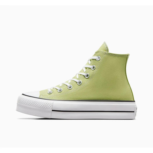 Baskets montantes vert vitalité Chuck Taylor All Star Lift de Converse, avec semelle plateforme blanche à rayures noires.