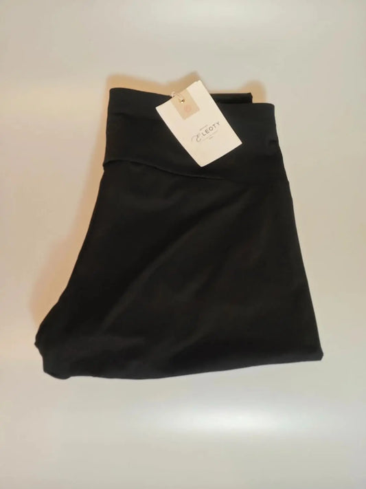 Legging noir de sport par Leoty, avec étiquette, sur fond neutre.